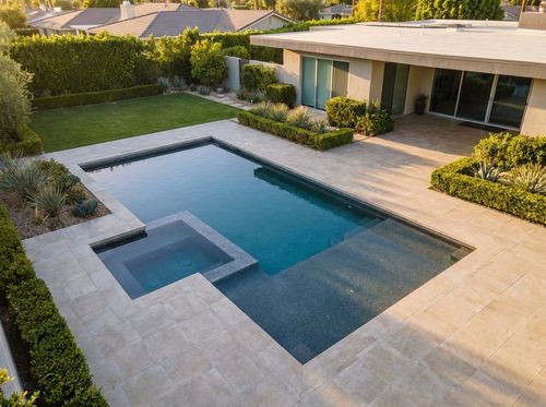 Rendering of geometric in-ground pool with a notched corner holding an attached square spa, dark pebble finish with deep blue water, large-format porcelain pavers, sharp contemporary house with flat roof