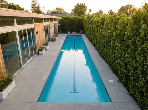 Rendering of a 10 by 40 foot lap pool with a lane line and a minimalist concrete deck