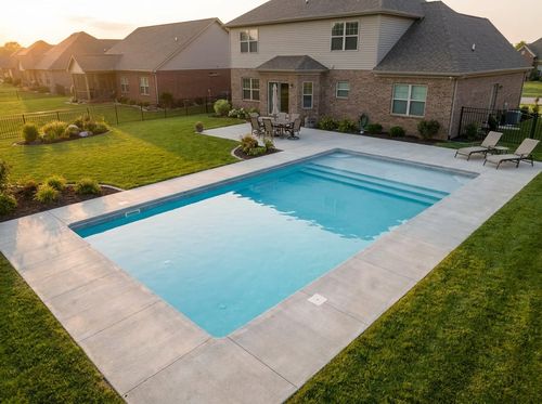 Rendering of a 16 by 32 foot rectangular family pool with corner steps and a small tanning ledge