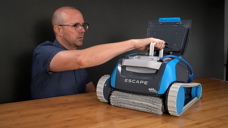 Justin from The Pool Nerd filming a hands-on pool cleaner test