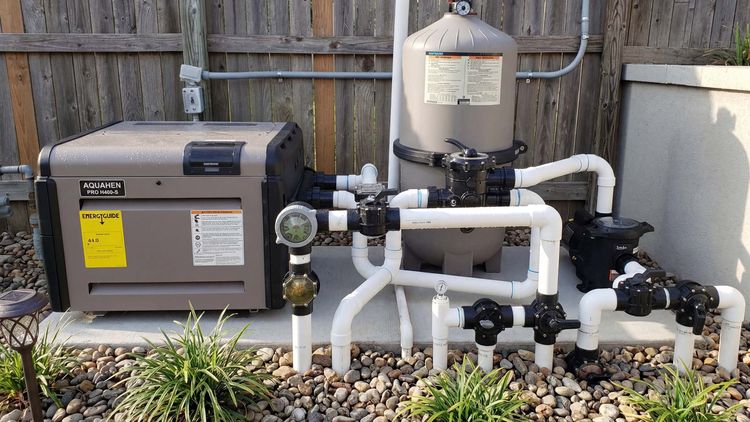 Hayward H-Series pool heater installed on an inground pool