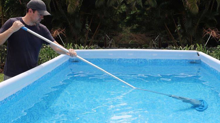A handheld is a manual spot cleaner — you walk it around the pool targeting specific messes