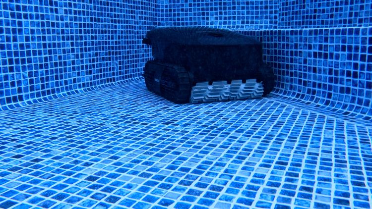 The robot near the pool stairs