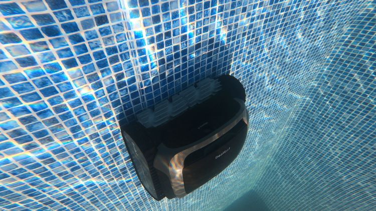 The AquaSense Pro cleaning a pool wall