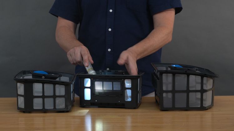 Inspecting the Beatbot Sora 30 filter basket against a light source