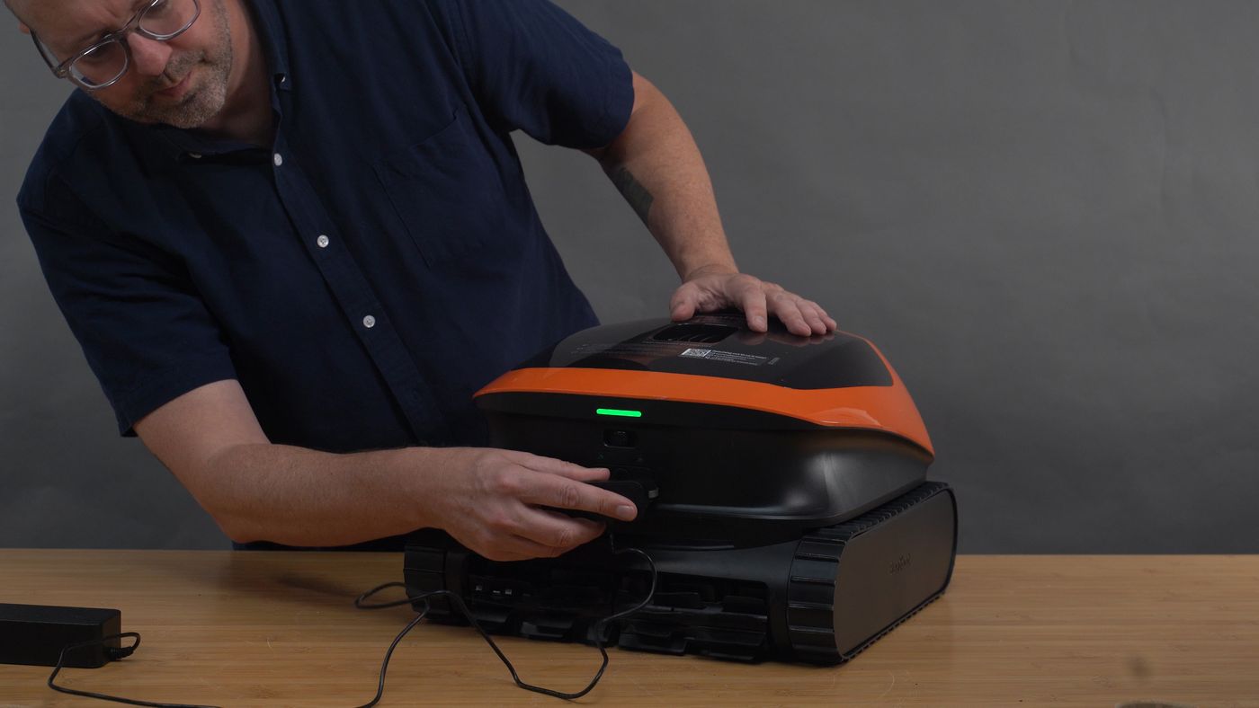 Connecting the charging cord to the Beatbot Sora 30