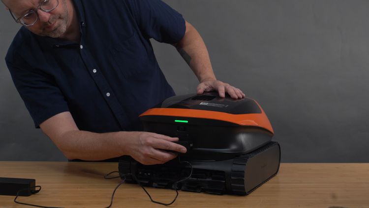 Connecting the charging cord to the Beatbot Sora 30