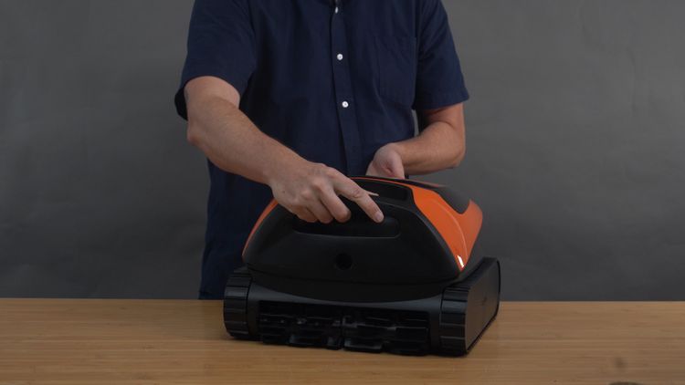 Lifting the Beatbot Sora 30 out of the pool by the handle