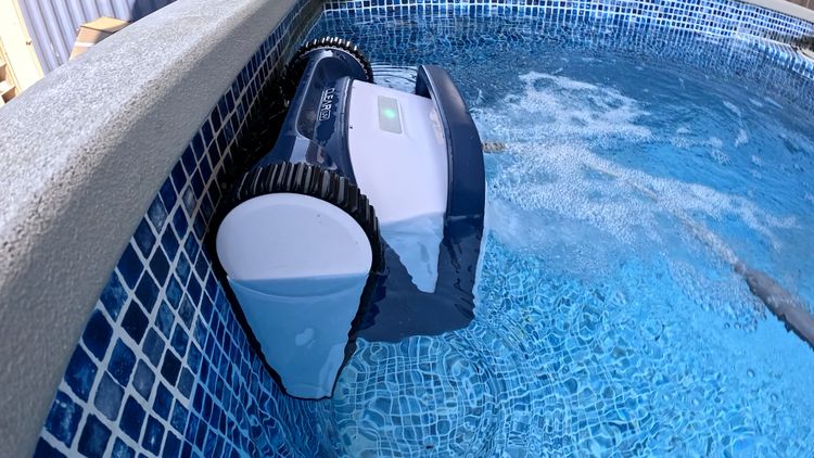 The Clear UV robotic cleaner working the floor while a skimmer handles the surface