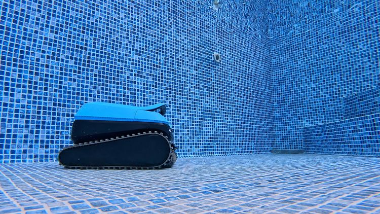 The EON 100 cleaning underwater along the far wall