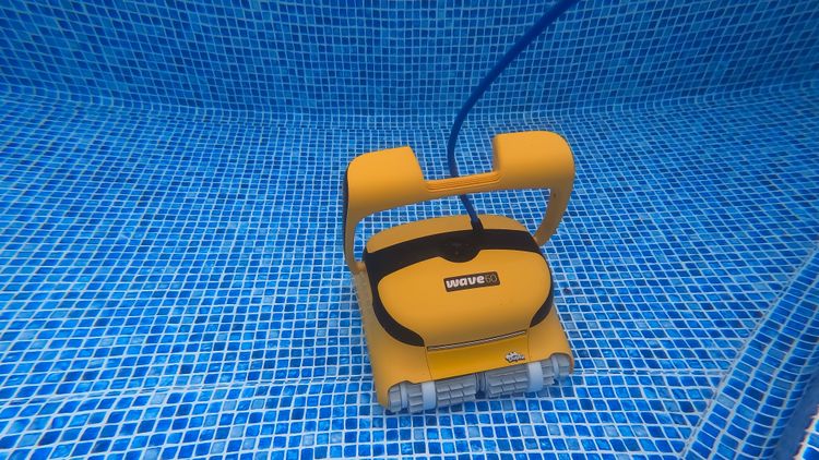 The Dolphin Wave 60 cleaning the floor of our test pool