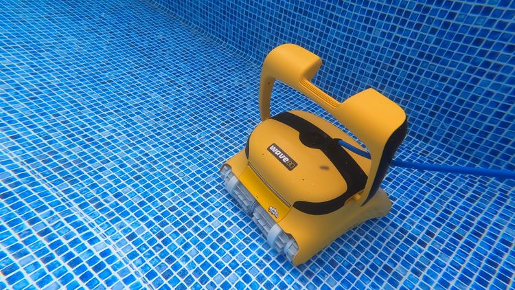 The Dolphin Wave 80 cleaning the floor of our test pool