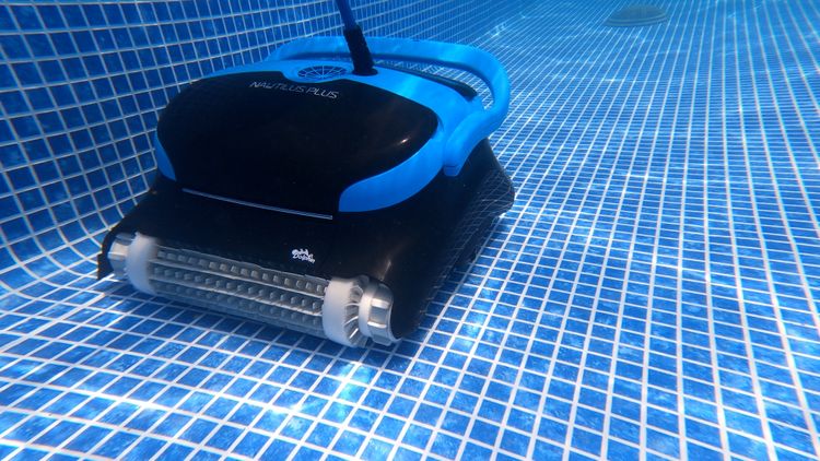 Dolphin Nautilus CC Plus cleaning along the pool wall