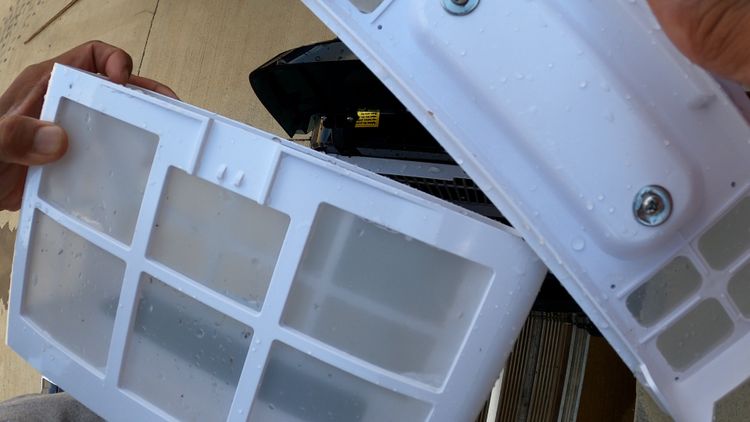 Wybot C2 dual-layer filter basket opened up showing both halves