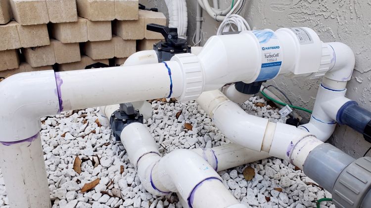 A Hayward TurboCell T-CELL-3 installed on a smaller pool — matching cell size to your actual gallons is what determines its lifespan