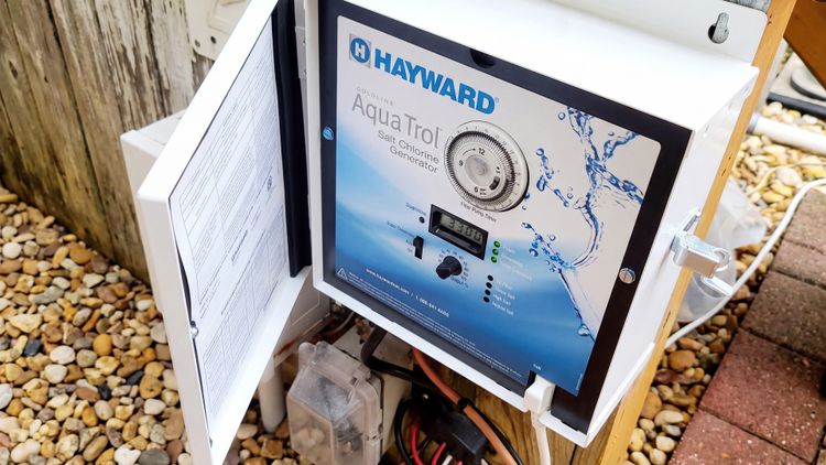 The AquaTrol control panel — built-in pump timer, output dial, and the same diagnostic lights as Hayward's in-ground systems